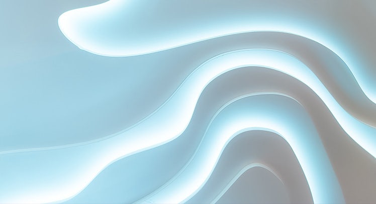 Wavy paper cut background with white and blue light